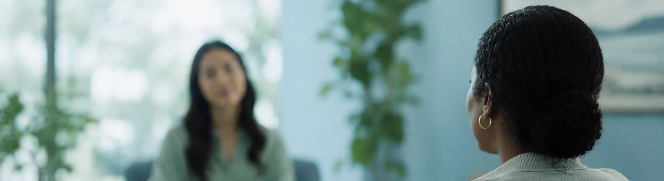 A female anxiety therapist meeting with a female patient.